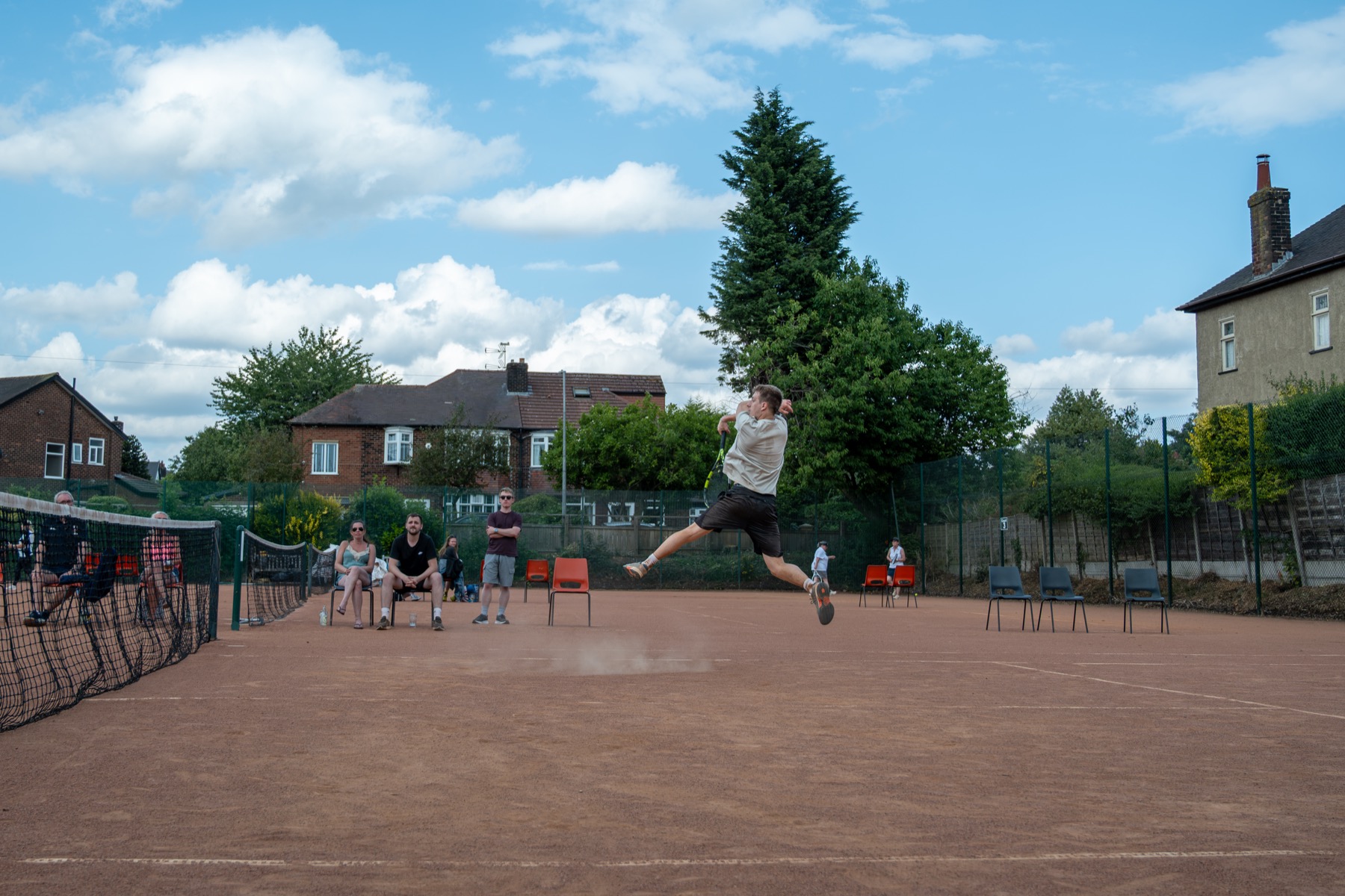 A Claremont player hitting an overhead shot
