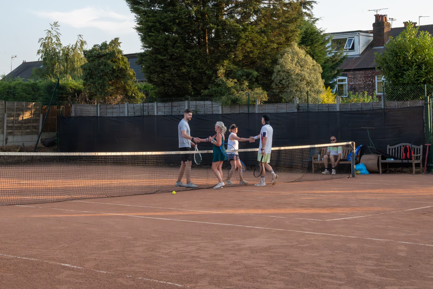 Mixed doubles players shaking hands at Claremont